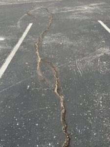 Cleaning debris before sealcoating