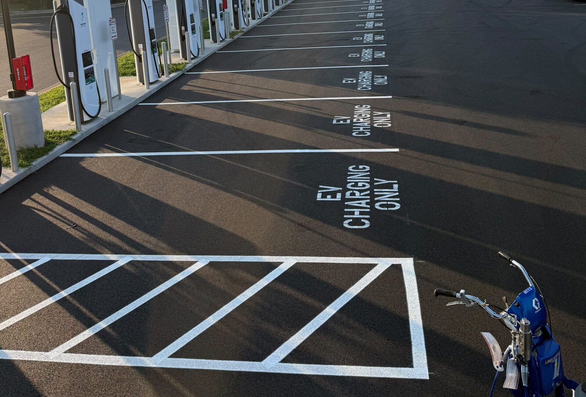 Recent Projects 1 EV charging station parking line striping and custom stencil in Springfield MO